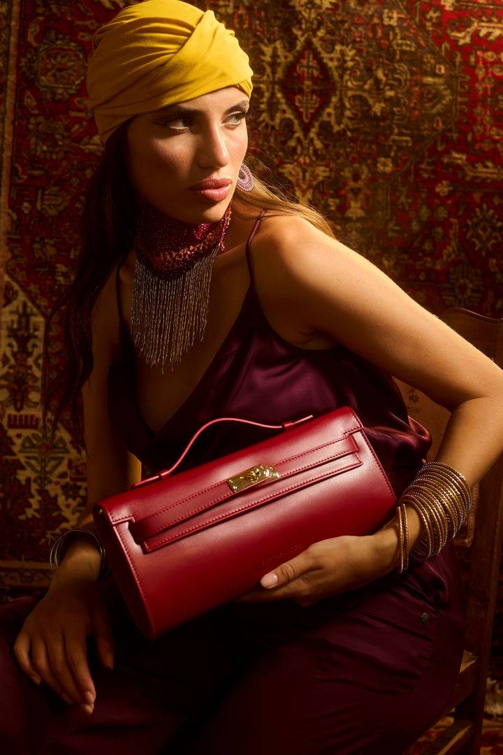 Roberta Gandolfi Jade cluch borsa in pelle con chiusura manico retrattile e tracolla staccabile e regolabile In Linea