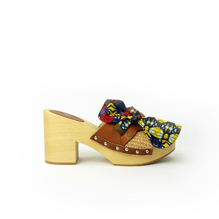 Roberta Gandolfi Diva Chain sandali in legno incrociato con platform in rafia e fiocco stamap african Moda