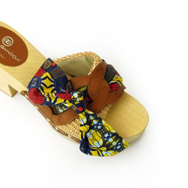 Roberta Gandolfi Diva Chain sandali in legno incrociato con platform in rafia e fiocco stamap african Moda