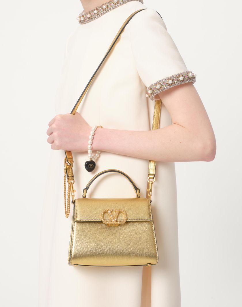 Valentino Handbags Borsa A Mano Mini Valentino Garavani Vsling In Vitello Granato Laminato Con Logo Gioiello per Donna in Antique Brass | Valentino IT Saldi Di Fabbrica