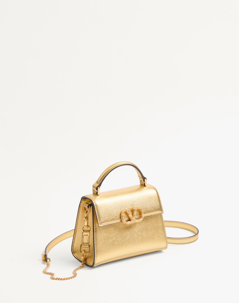 Valentino Handbags Borsa A Mano Mini Valentino Garavani Vsling In Vitello Granato Laminato Con Logo Gioiello per Donna in Antique Brass | Valentino IT Saldi Di Fabbrica